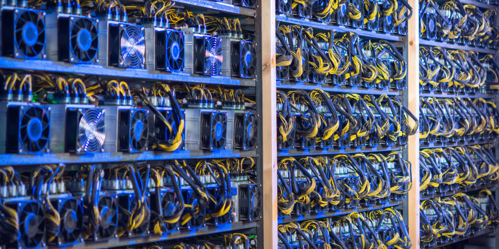 racks of bitcoin mining rigs